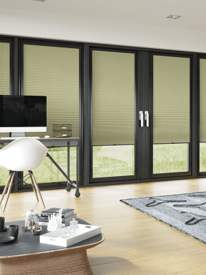 Pleated Bi Fold This image shows khaki green pleated bi-fold blinds fitted onto black framed glass doors